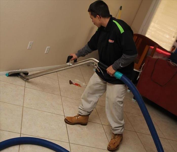 A big storm in Las Vegas caused a massive flood inside this home, our team is seen in the photo extracting water.